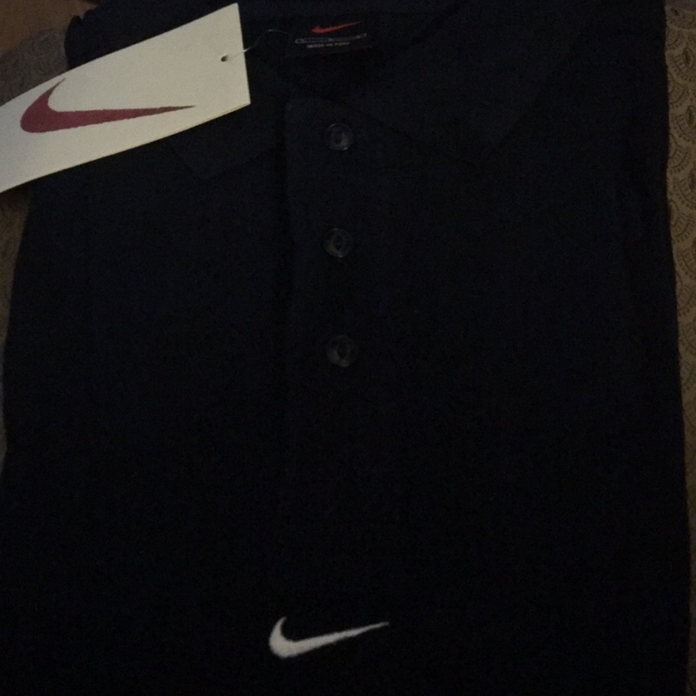 Never worn navy blue Nike Polo shirts.